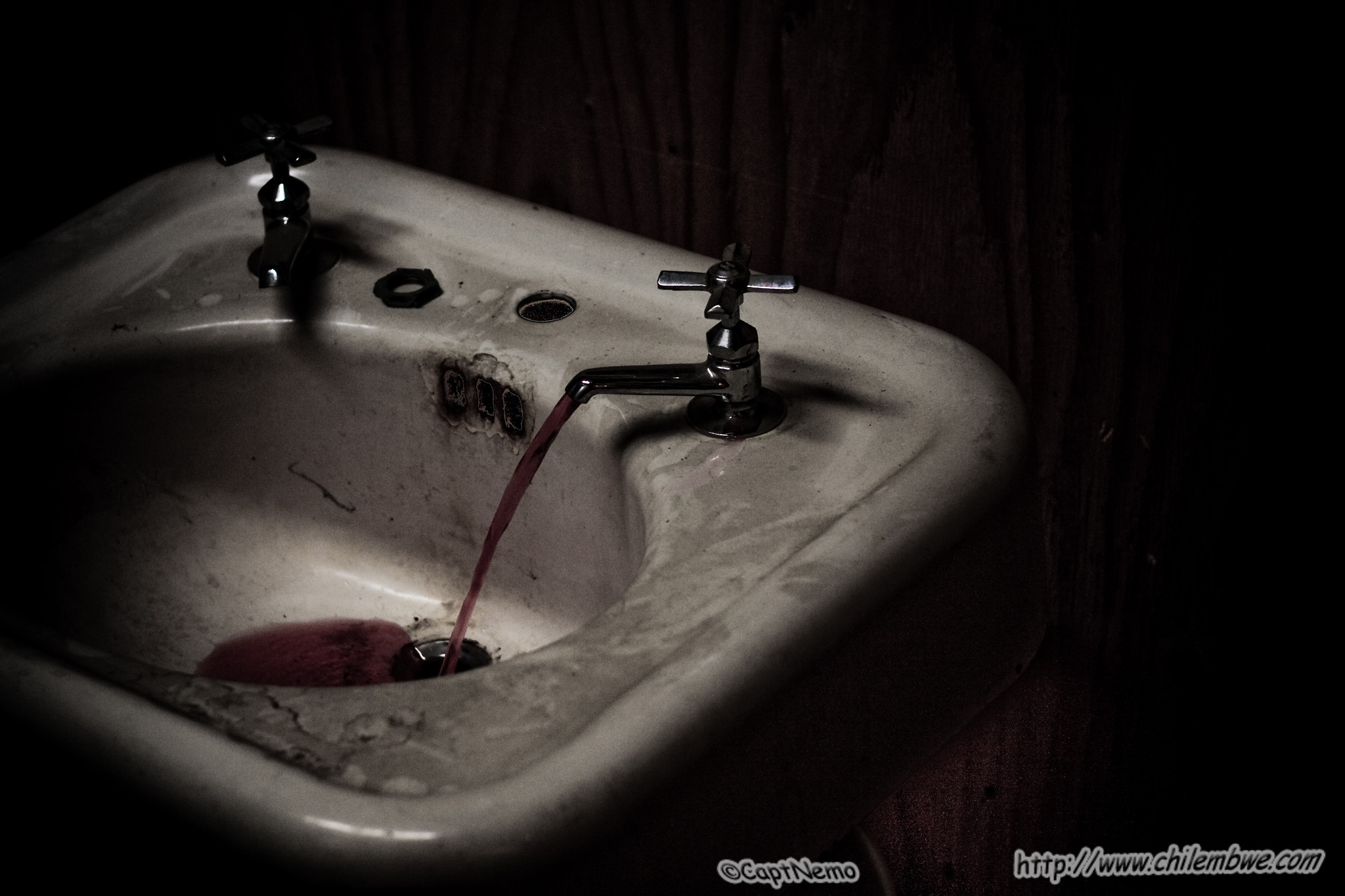 Old sink with red water